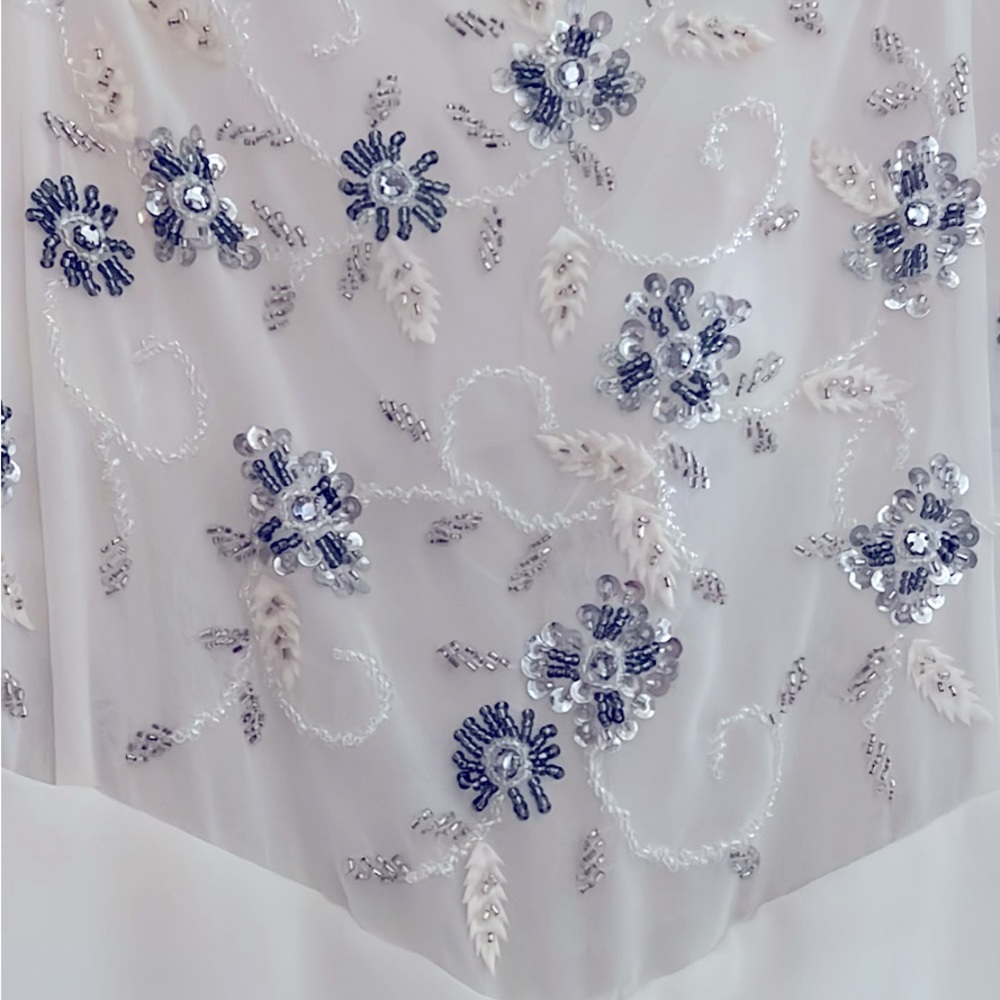 Evening/ wedding dress.BRAND NEW NEVER WORN!  Beautiful beading and material